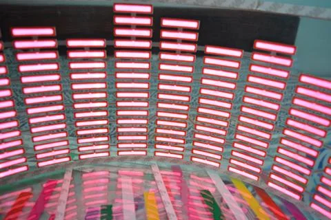 Red glowing plastic equalizer, electronics glowing to the music. 스톡 사진