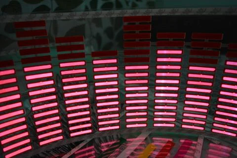 Red glowing plastic equalizer, electronics glowing to the music. 스톡 사진
