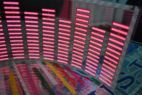 Red glowing plastic equalizer, electronics glowing to the music. 스톡 사진