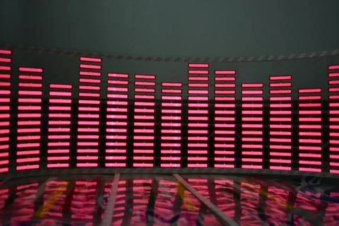 Red glowing plastic equalizer, electronics glowing to the music. 스톡 사진