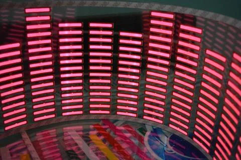 Red glowing plastic equalizer, electronics glowing to the music. 스톡 사진