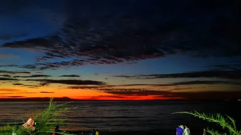 Red golden sunsets by the beach Stock Footage 338183569