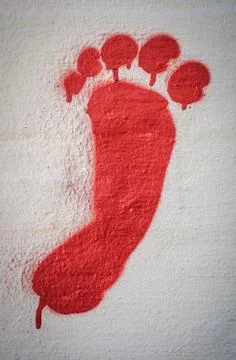 Red graffiti foot Stock Photos
