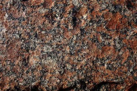 Red granite texture of decorative wall on the building Stock Photos