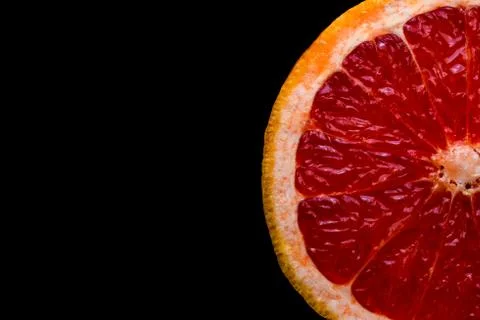 Red grapefruit on black background Stock Photos