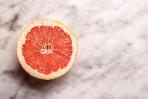 Red grapefruit on marble background Stock Photos