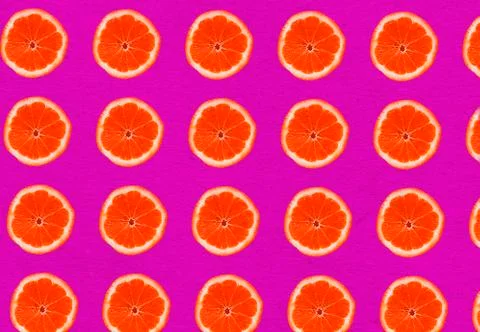Red grapefruit slices on red background, healthy food Stock Photos