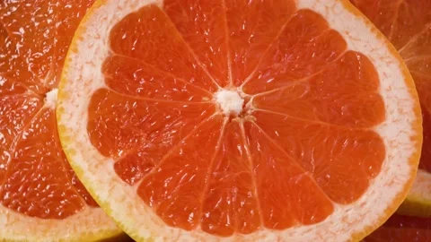 Red grapefruits top view on rotating background 스톡 동영상 146288113