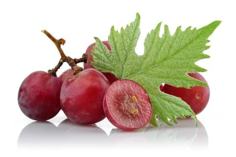 Red grapes and half grape with leaf Stock Photos