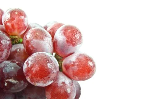 Red grapes on white background. Stock Photos