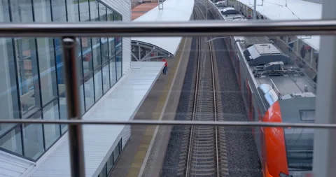 Red-gray train arrivals from the ground metro station. Top transition view Stock Footage 119637682