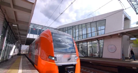 Red-gray train arrivals from the ground metro station Stock Footage 119638620