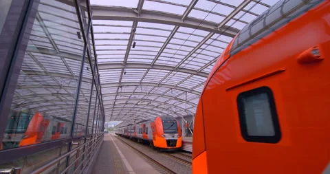 Red-gray train departs from the ground metro station Stock Footage 119631257