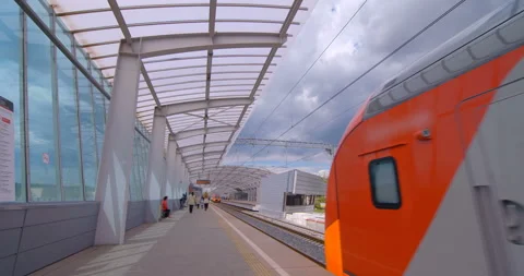 Red-gray train departs from the ground metro station Stock Footage 119632316