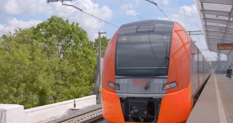 Red-gray train departs from the ground metro station Stock Footage 119632628