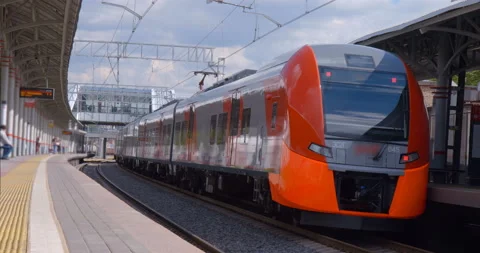 Red-gray train departs from the ground metro station Stock Footage 119635663