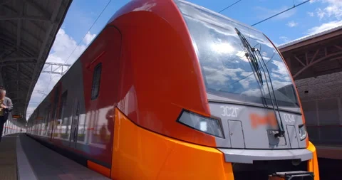 Red-gray train departs from the ground metro station Stock Footage 119636124