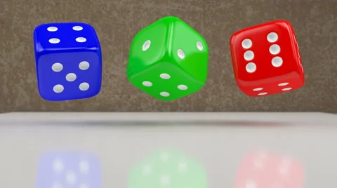 Red, green and blue dices rotating above shining table Stock Footage 65003775
