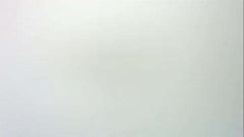 Red Green And White Candy Fall And Slide Across White Table Stock Footage 70333804