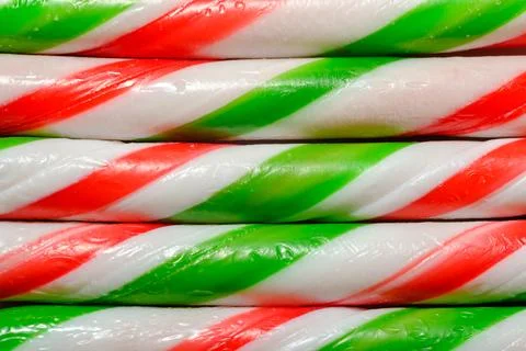 Red Green and White Striped Candy Canes Christmas Holiday Candy Background Fotos de archivo