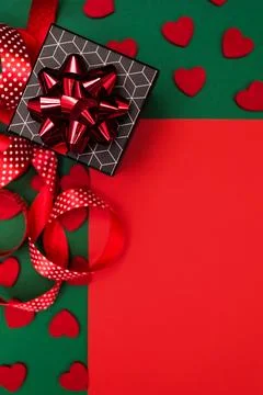 Red-green background with gift boxes with geometric pattern. Stock Photos