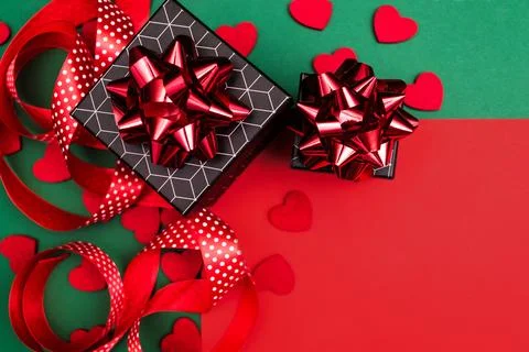 Red-green background with gift boxes with geometric pattern. Stock Photos