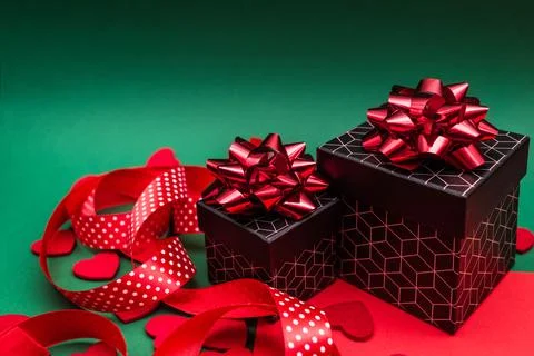 Red-green background with gift boxes with geometric pattern. Stock Photos