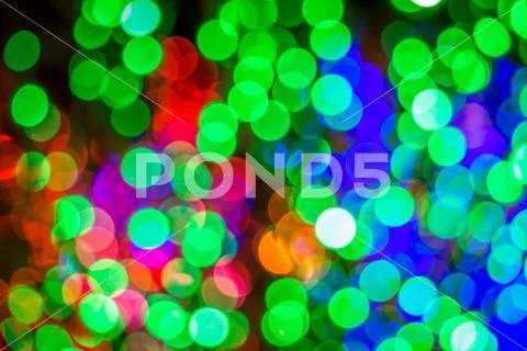 Red Green Purple Orange and Blue Christmas Lights Bokeh Stock Photos