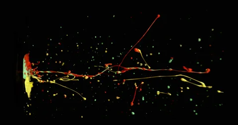 Red, green &amp; yellow paint in motion in 4K Stock Footage 59921276