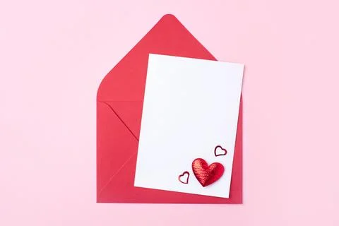 Red greeting envelope on pink background Stock Photos