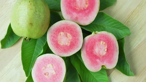 Red Guava fruit with leaf on blur garden background, Fresh Pink Guava fruit on w Stock Footage 235959288