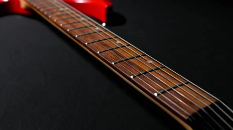 Red Guitar on a Black Background Stock-Footage 62347601