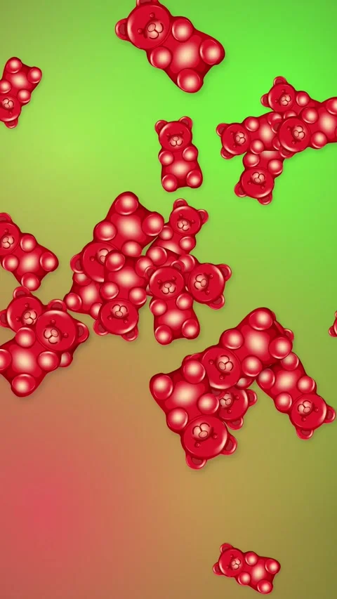Red Gummy Bears Falling Over a Vibrant Green and Red Mesh Background Stock Footage 344833141