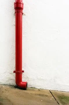 Red gutter in white wall Stock Photos