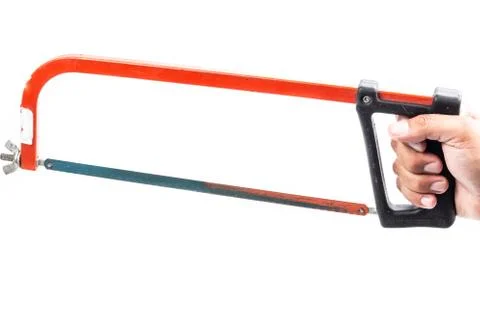 Red hacksaw on a white background in studio Stock Photos