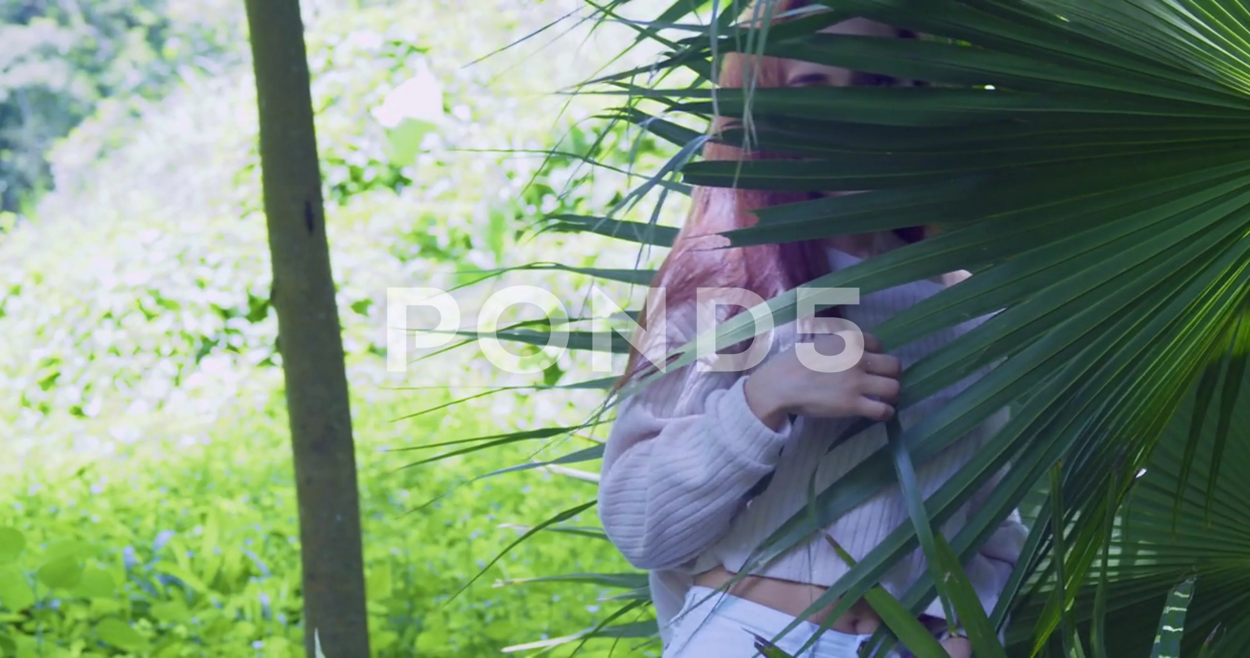 Red hair latina model spin while her hair flows in the wind while standing