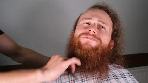 Red haired beard combing Stock Footage 254728793