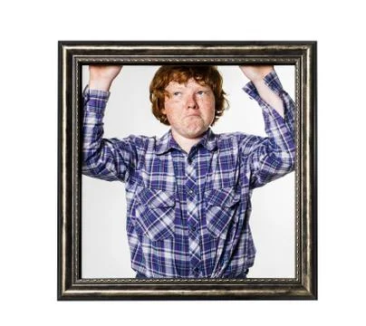 Red-haired boy posing with picture frame Stock Photos