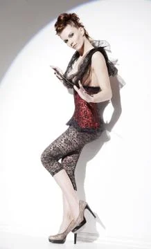 Red haired with corset Stock Photos