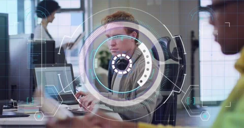 Red-haired engineer typing laptop at tech office starting ringed HUD aligning Stock Footage 321591749