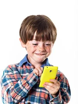 Red-haired funny boy with mobile phone Stock Photos