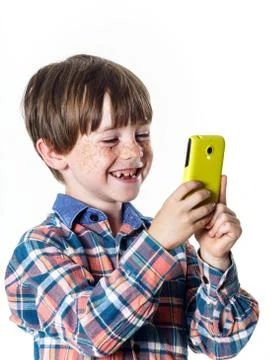 Red-haired funny boy with mobile phone Stock Photos
