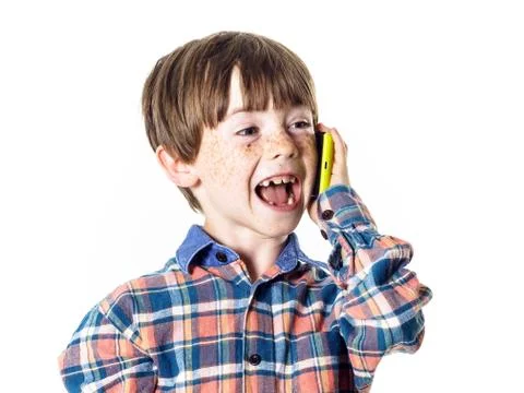 Red-haired funny boy with mobile phone Stock Photos