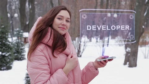 Red-haired girl with hologram Developer Stock Footage 107667517