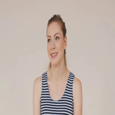 Red-haired girl looking at the camera and smiling, dressed in a vest Stock-Footage 69495911