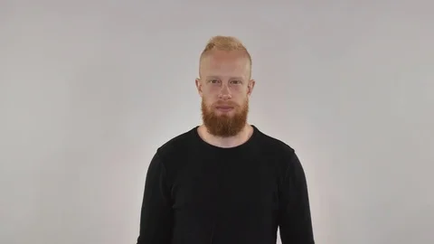 Red-haired guy with a beard shows the sign of heavy metal Stock Footage 82113715