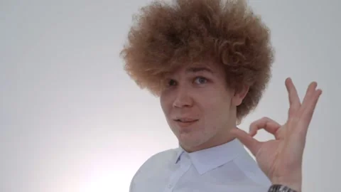 The red-haired guy shows the OKAY sign with his fingers Stock Footage 146576343