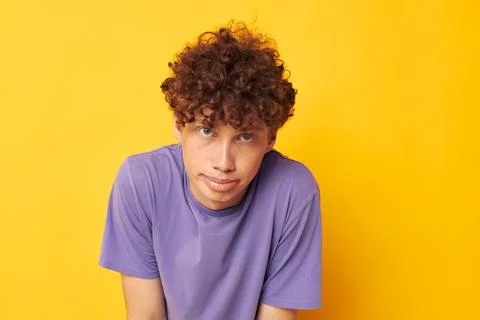 Red haired guy summer posing style fashion yellow background Stock Photos