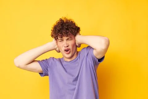 Red haired guy summer posing style fashion yellow background Stock Photos