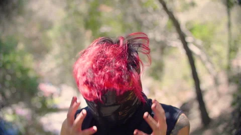 Red-haired man in plastic tape mask shakes head in anger and rage Stock Footage 294636866